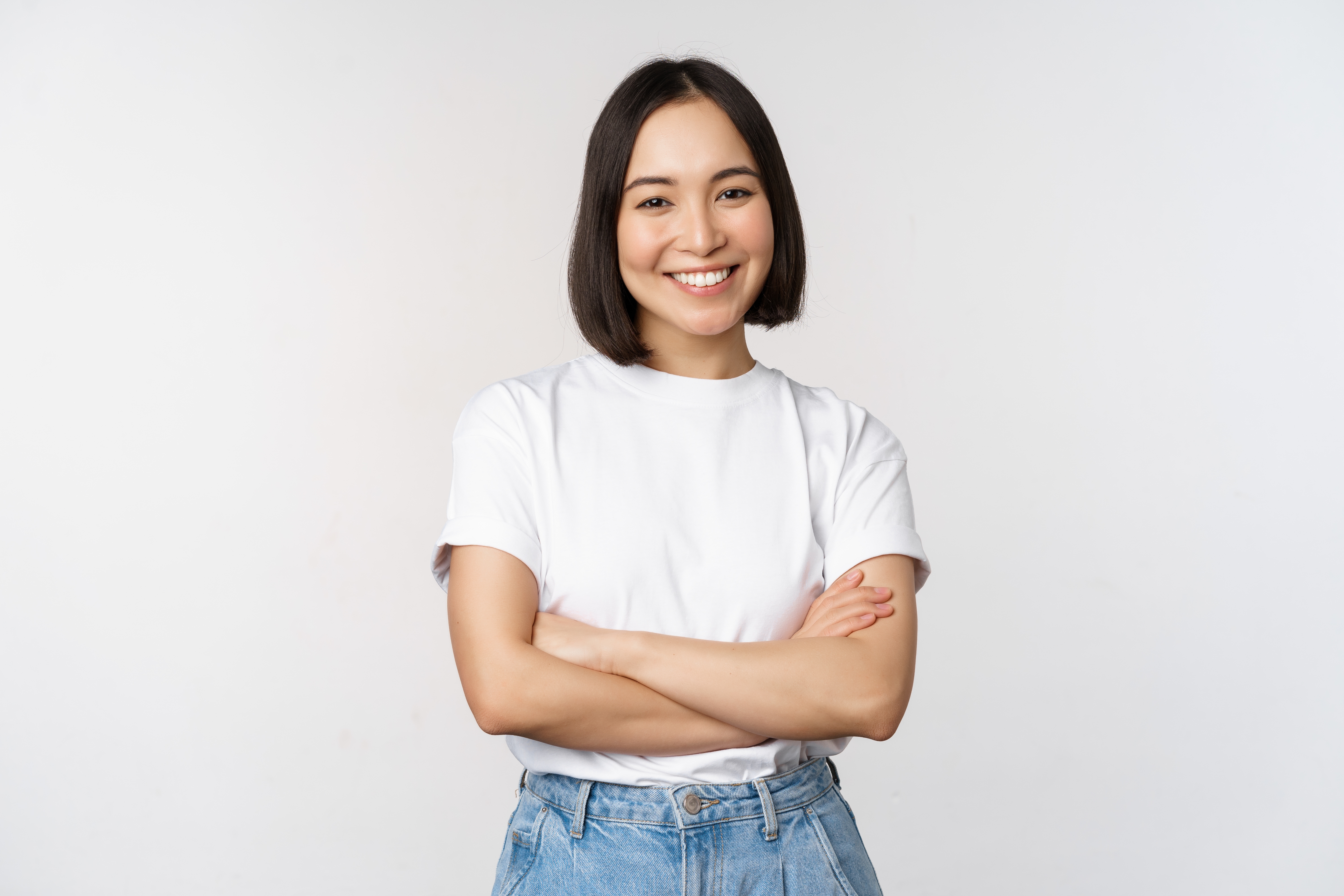 Young professional woman posing confidently in a headshot for coaching